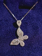 Load and play video in Gallery viewer, 18K White Gold Diamond Butterfly Necklace: Baguette Cluster Pendant
